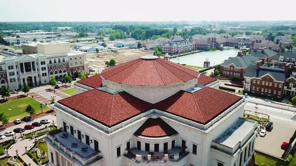 4k Aerial View of Drone flyover of Carmel arts district outside Indianapolis on bright sunny day