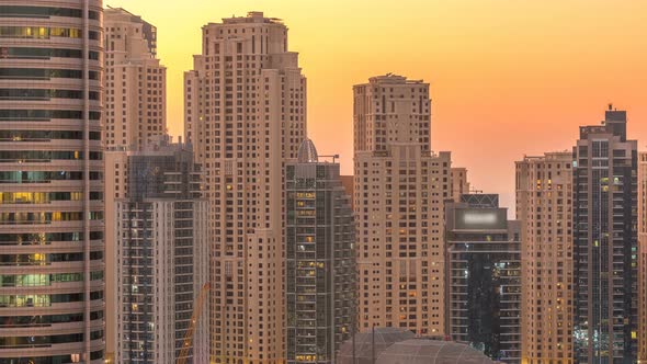 Dubai Marina and JBR Twers Panorama Day to Night Timelapse Lights Turn on