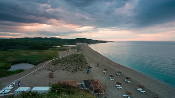 Time lapse with an empty wild beach at sunset.