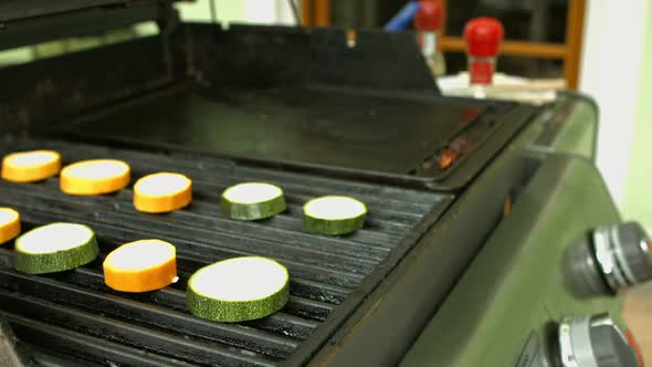 Detail Putting Food on Grill