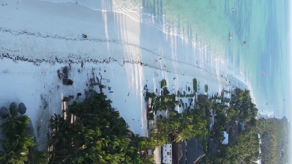 Vertical Video Boats in the Ocean Near the Coast of Zanzibar Tanzania Aerial View