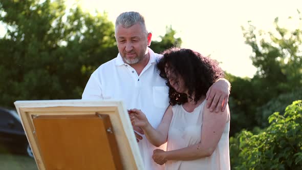 Mature Couple on a Date Painting Together