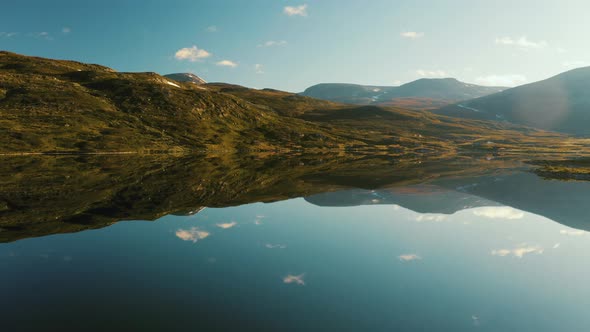 Mesmerizing Reflections Of Mountains And Sky At The Vavatnet Lake In Hydalen, Hemsedal, Norway On A