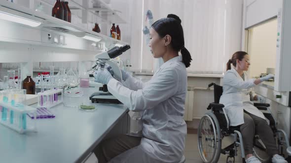 Three Scientists Working in Lab