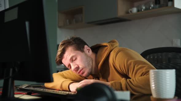 Man Sleeping at Workplace While Working at Night