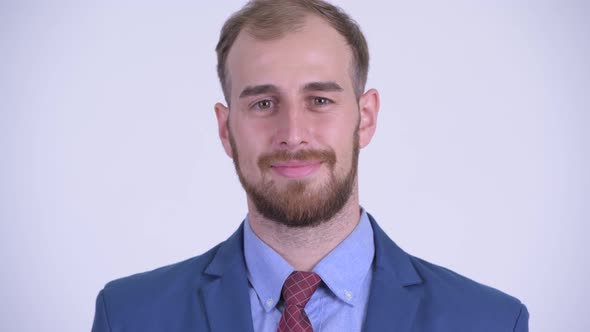 Face of Happy Bearded Businessman in Suit Smiling