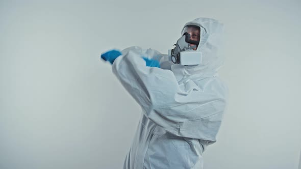 Happy Doctor in Protective Medical Suits Dance in the Hospital. Doctor Is Happy with the Success in