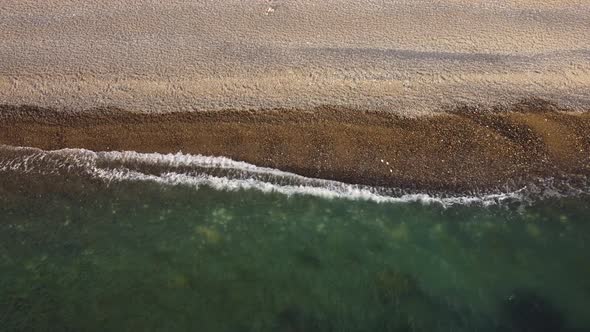 Aerial View From Above on Azure Sea and Pebbles Beach