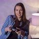 A Young Woman is Playing a Game Console - VideoHive Item for Sale