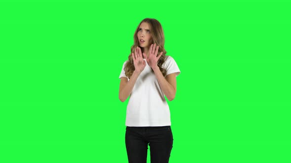 Lovable Girl Negatively Waving Her Head Expressing She Is Innocent. Green Screen