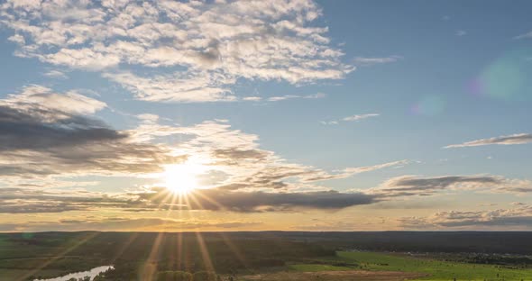 Beautiful View of the Wild Field During Sunset, Time Lapse, Clouds of Different Levels Move To the