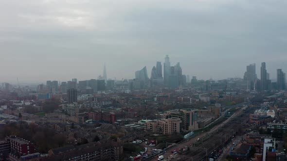 High slider drone shot of Central London skyline on a hazy day