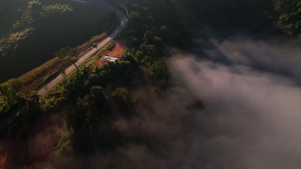 4K Morning mist over a rural village in the high mountains.