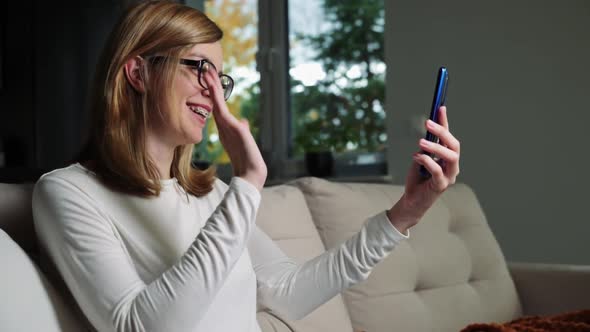 Woman at Living Room Use Smartphone for Video Call