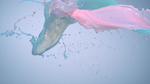 Milky green and pink liquid splash, Slow Motion