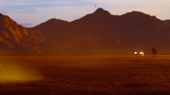 White Luxury Off-Road Vehicle Rapidly Coming From Horses in Mountainous Area with Sunset View