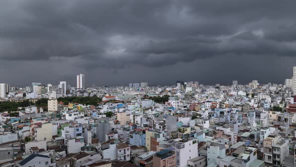 Dramatic Time Lapse of Storm clouds over terrace houses, rooftops and narrow alleyways of Binh Thanh