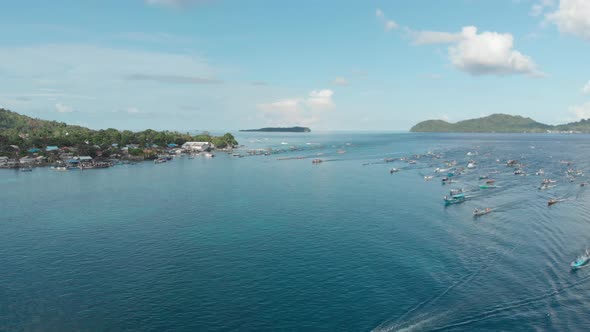 Aerial: kora-kora traditional canoe annual race in Banda Neira Indonesia