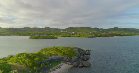 Aerial of green landscape on both sides of sea, Cap Chevalier