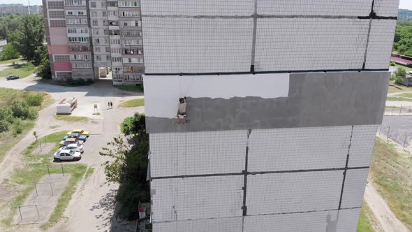 Industrial Climber Painting Building Facade Wall, Insulation Work, Aerial View