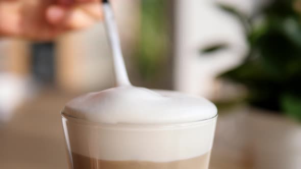 Eating Foam Or Thick Froth Of Hot Coffee Latte 