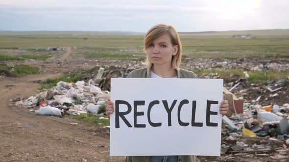 Activist Woman Portrait Holding Recycle Poster and Raising It Iroi