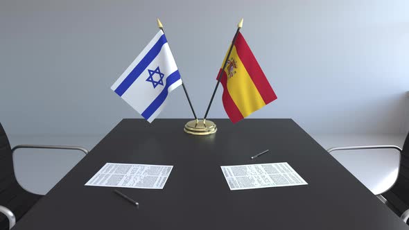 Flags of Israel and Spain on the Table alt