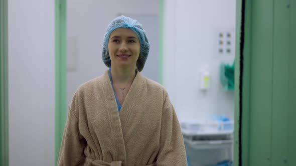 Portrait of Confident Slim Young Caucasian Woman Entering Operating Room Smiling Leaving in Slow