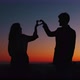Silhouette of couple making heart symbol in Valentine's day - VideoHive Item for Sale