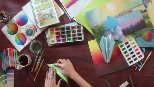 Artist Making Origami Top View