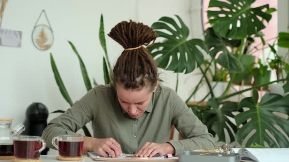 Woman Fixes Glass Plates