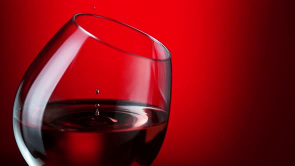 Super Slow Motion Shot of Wine Drop Falling Into Red Wine in Glass at 1000Fps