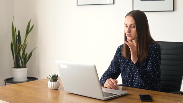 Confident Businesswoman is Holding Video Call on the Laptop