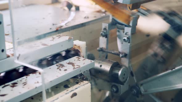 Packing Machine Is Processing Chocolate Candies