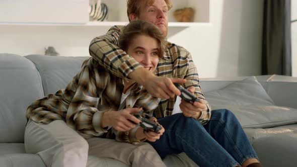 Emotional Friends Play Gamepad Video Game at Home