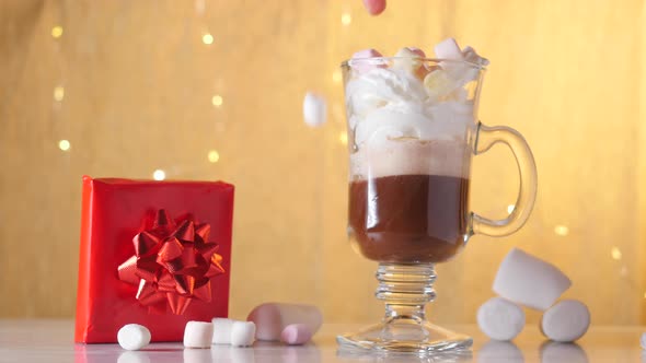 Preparing Hot Chocolate with Cream and Marshmallows