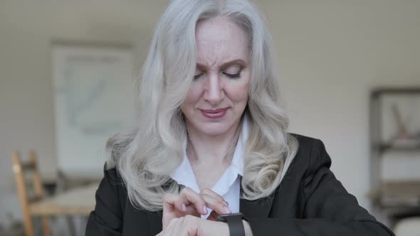 Senior Businesswoman Using Smartwatch