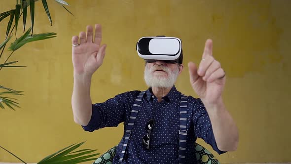 Senior Gray-Bearded Man which Working on Imaginary Screen Using Special 3d Glasses