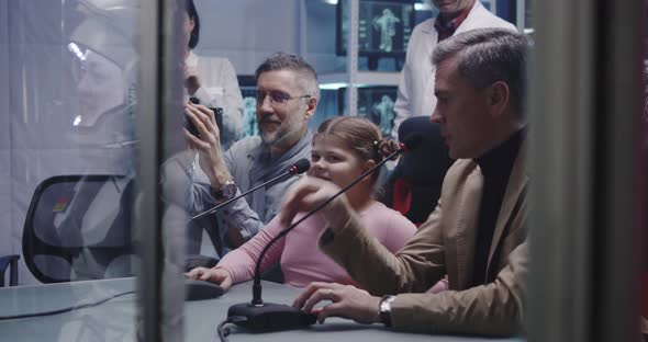 Girl Talking with Astronaut at Press Conference