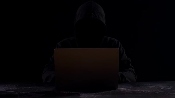 Hacker Using Laptop Computer Hacking With Dark Background