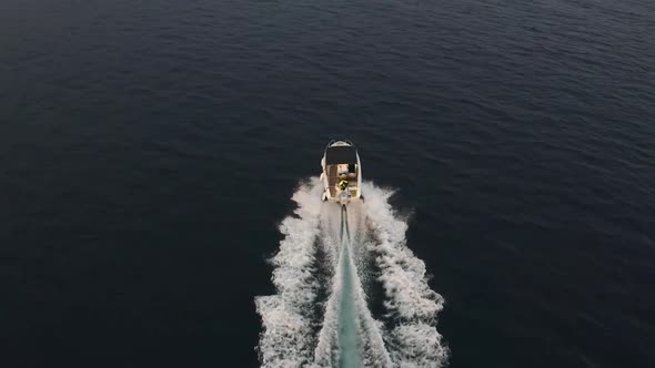 A speedboat speeds across the Adriatic sea near Dubrovnik, Croatia - Aerial