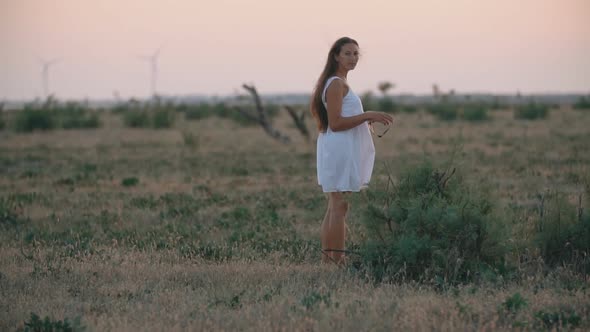 Woman in a White Dress and with Long Hair