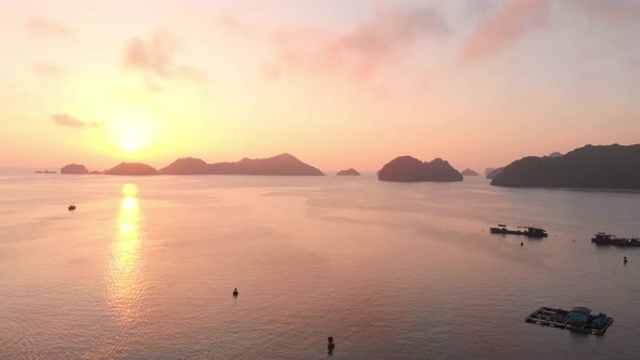 Aerial: sunset clear sky at Cat Ba island and beach with new tourist resort, Vietnam