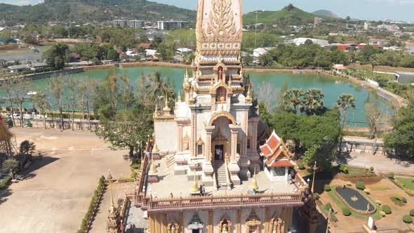 Tourists visiting the buddhist Wat Chalong temple in Phuket, Thailand