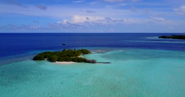 Luxury flying clean view of a white sand paradise beach and aqua blue water background in high resol