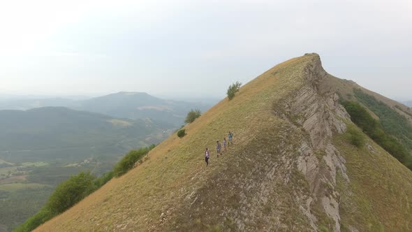 Group of four friends hiking in Umbria, Italy