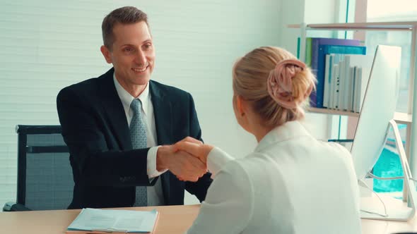 Job Seeker and Manager Handshake in Job Interview