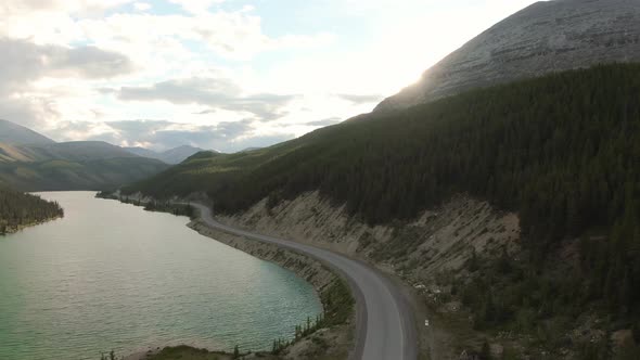 Gorgeous View of Glacial Lake and Scenic Road at Sunset