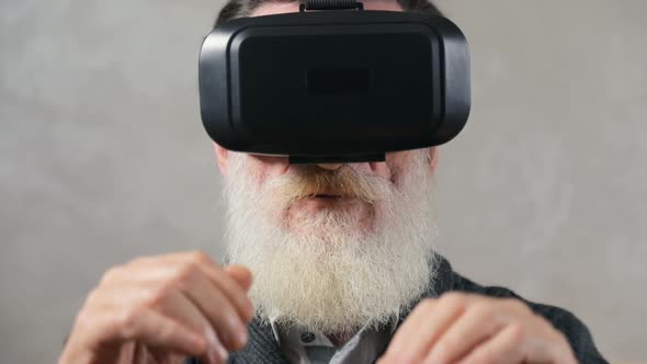 Elderly Man Puts on Virtual Headset