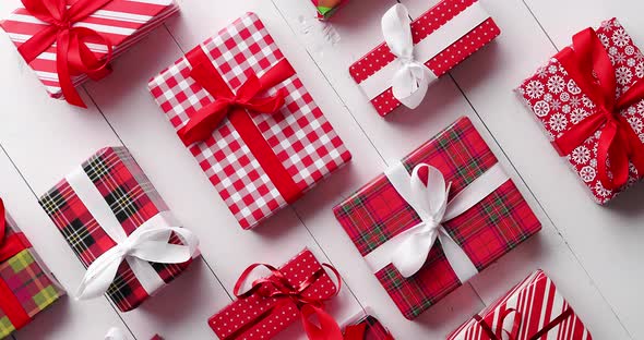 Side View of Wrapped Christmas Presents Laid on the Wooden Table